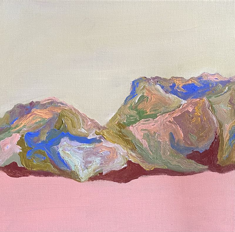 Mountains in pink, blue and green on a pale ground