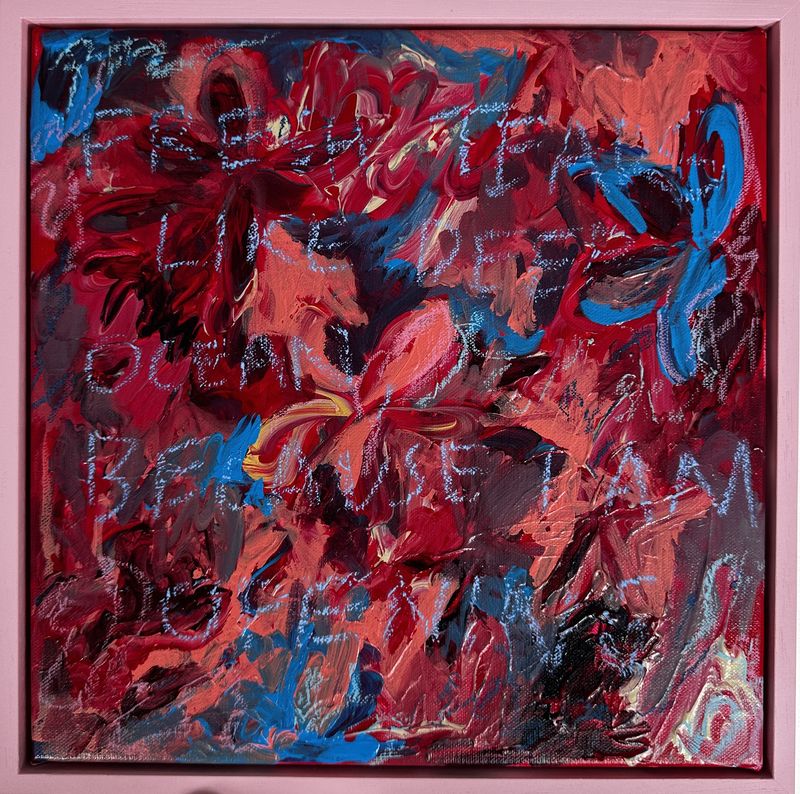 Red and pink textured painting with words scratched into the surface
